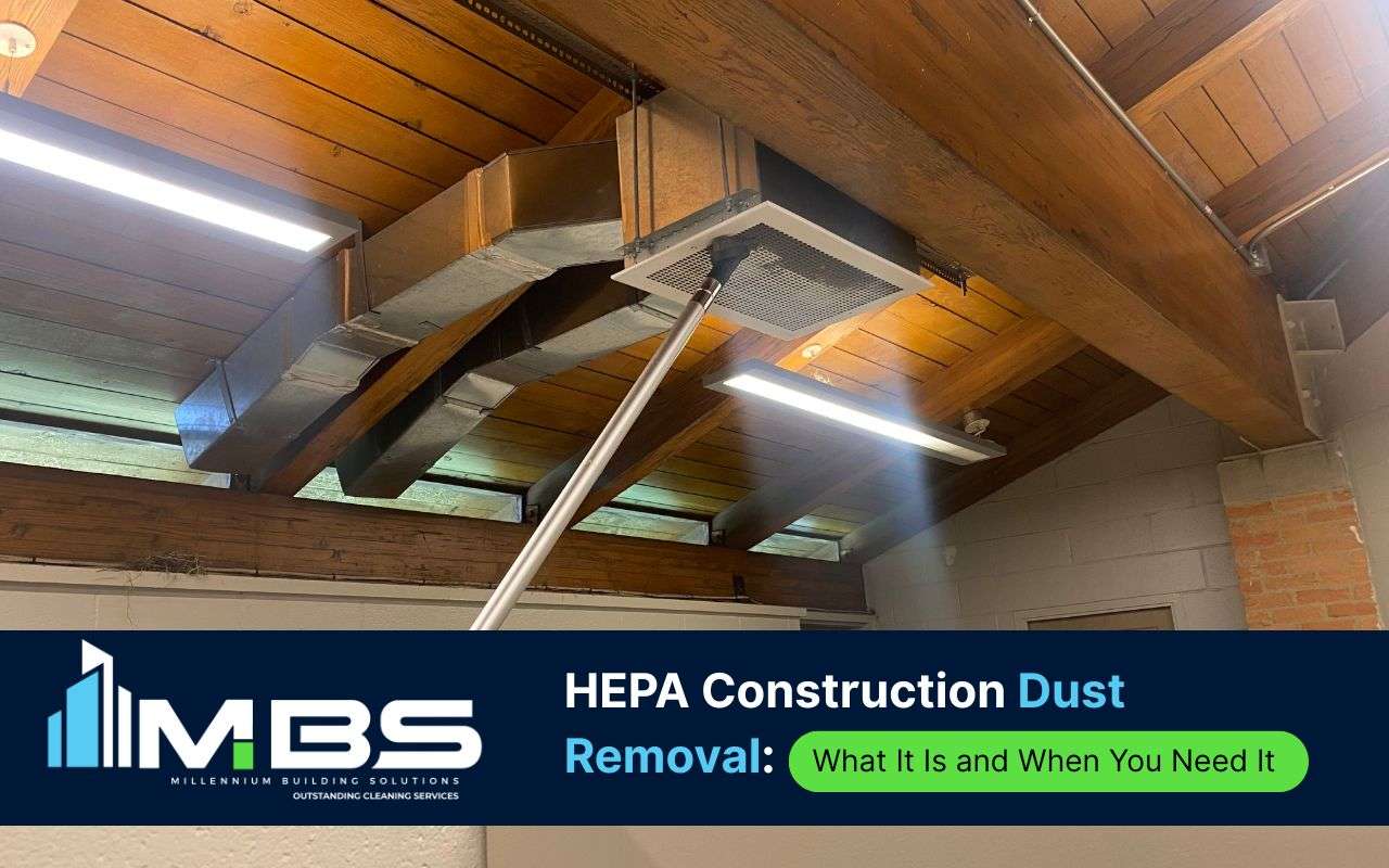 Worker performing HEPA construction dust removal on post-construction site