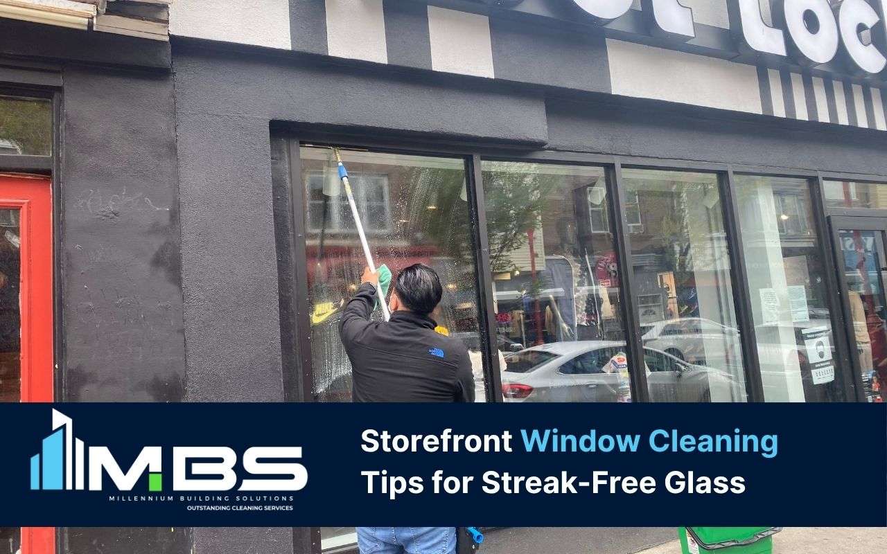 Worker safely cleaning high windows following storefront window cleaning tips